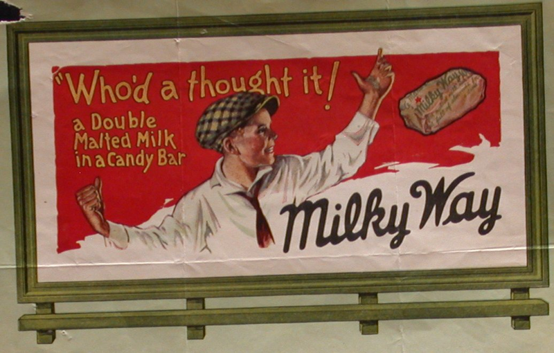 Early Milk Way Sign with young boy and “Who’d a thought it! A double malted milk in a candy bar” slogan